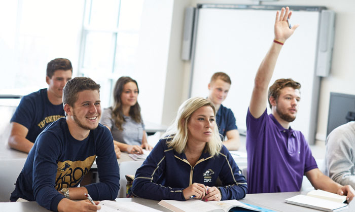 Students socializing in a exloratory community room at bet365官网 bet365官网 of bet365官网