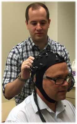 Electroencephalogram (EEG): Graduate Student Jim Houston caps Dr. Allen.