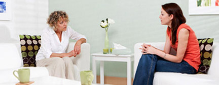 A counselor and patient in a mental health therapy session