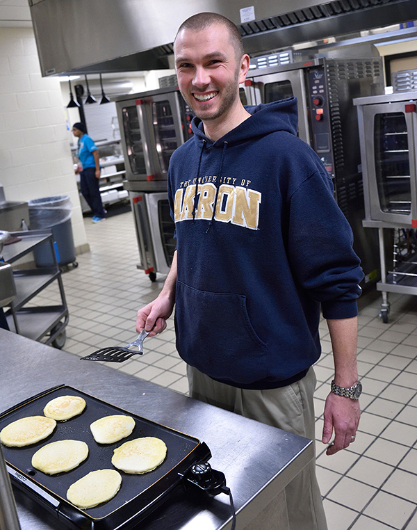 student making pancakes