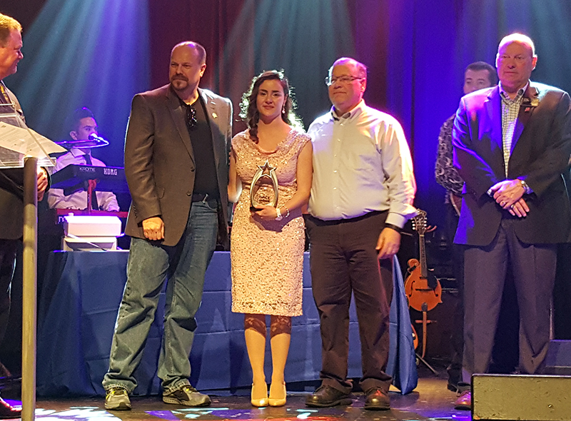 Ana Bacco with award