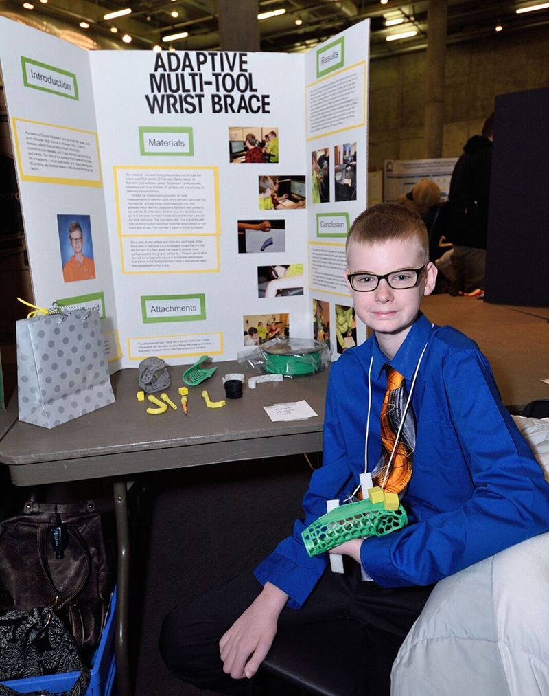 Cooper Meshew with poster Cooper Meshew with poster
