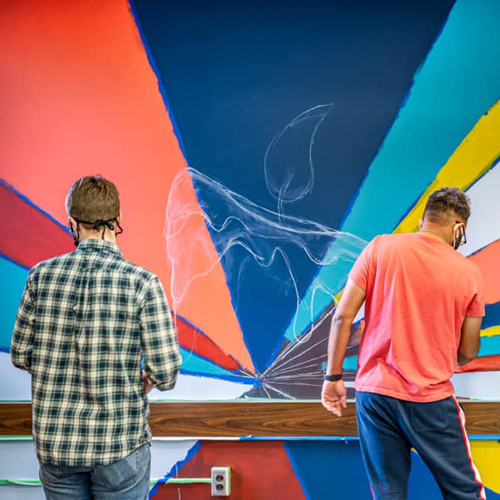Mural art creation in Bierce Library at the bet365官网 of bet365官网