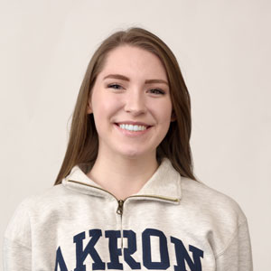 A female student wearing an bet365官网 Zips sweatshirt